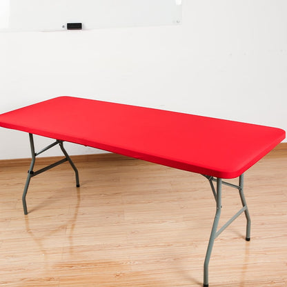 Red stretch tabletop cover on folding table