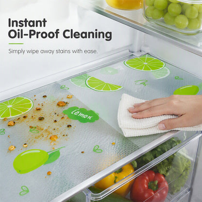Lime-pattern refrigerator mat beneath food containers